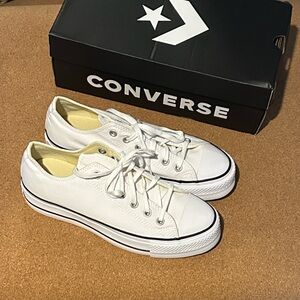 Converse lifts White Low-Top Canvas Sneaker with Black Stripes